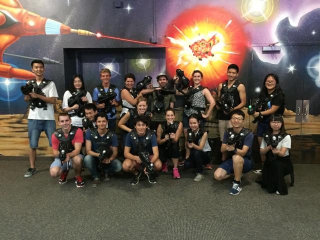 group picture of lab in laser tag uniforms